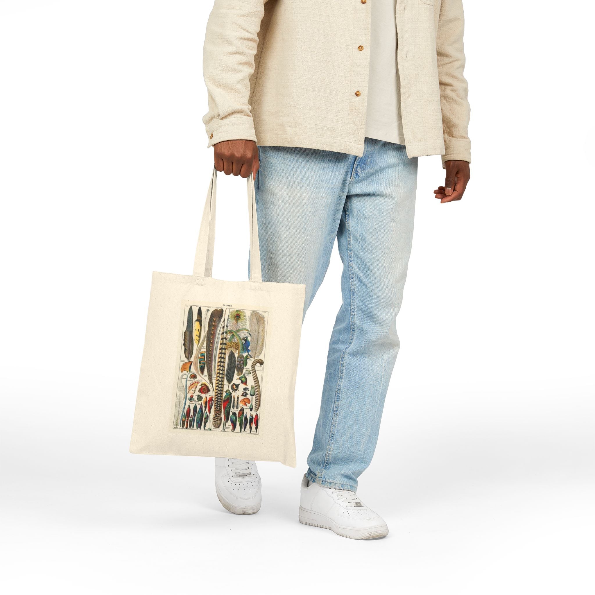 Stylish man carrying a cotton canvas tote bag with colorful graphics, perfect for eco-friendly shopping or everyday use.
