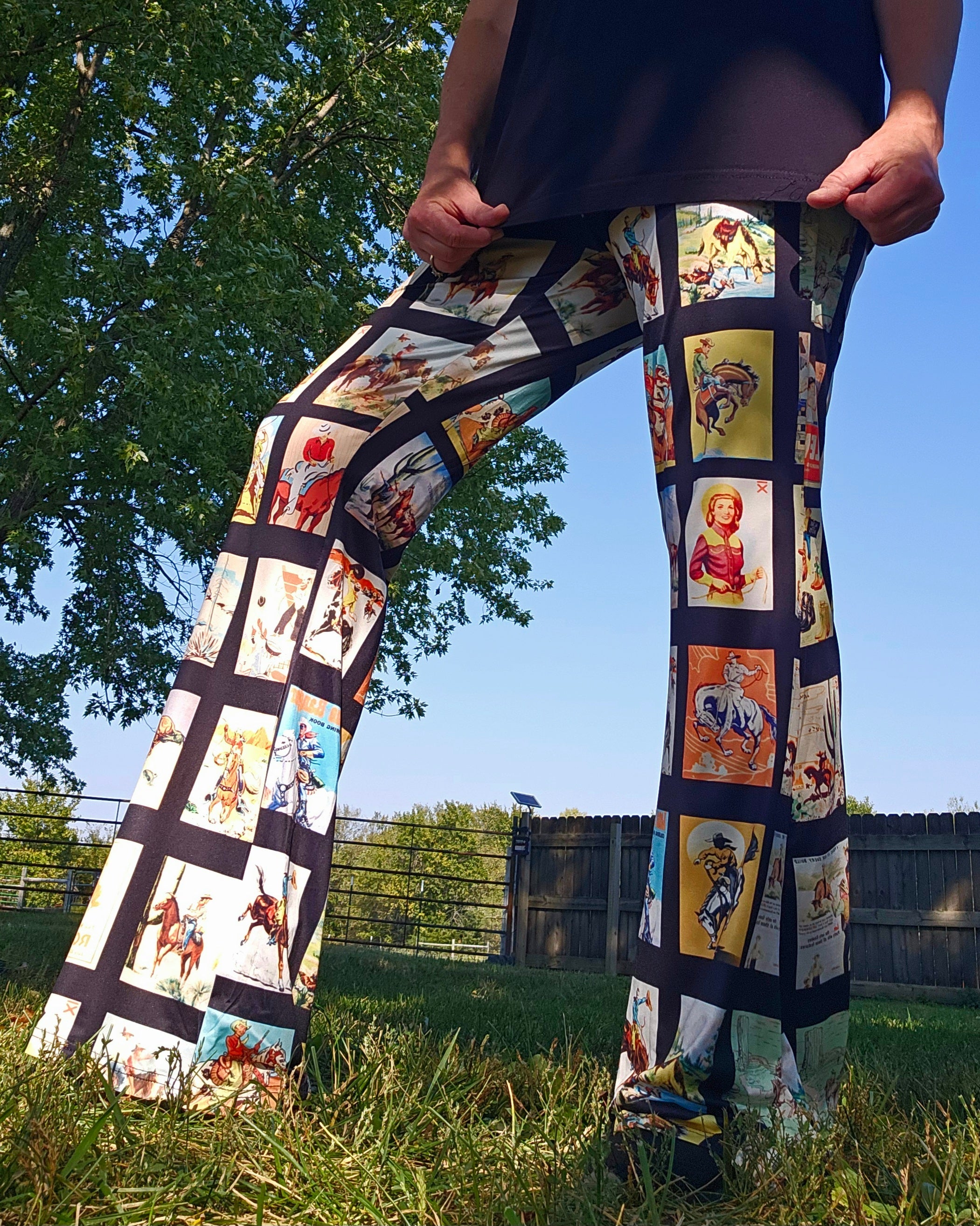 Vintage Cowboy Collage Western Flare Pants featuring rodeo-themed prints in a natural outdoor setting.