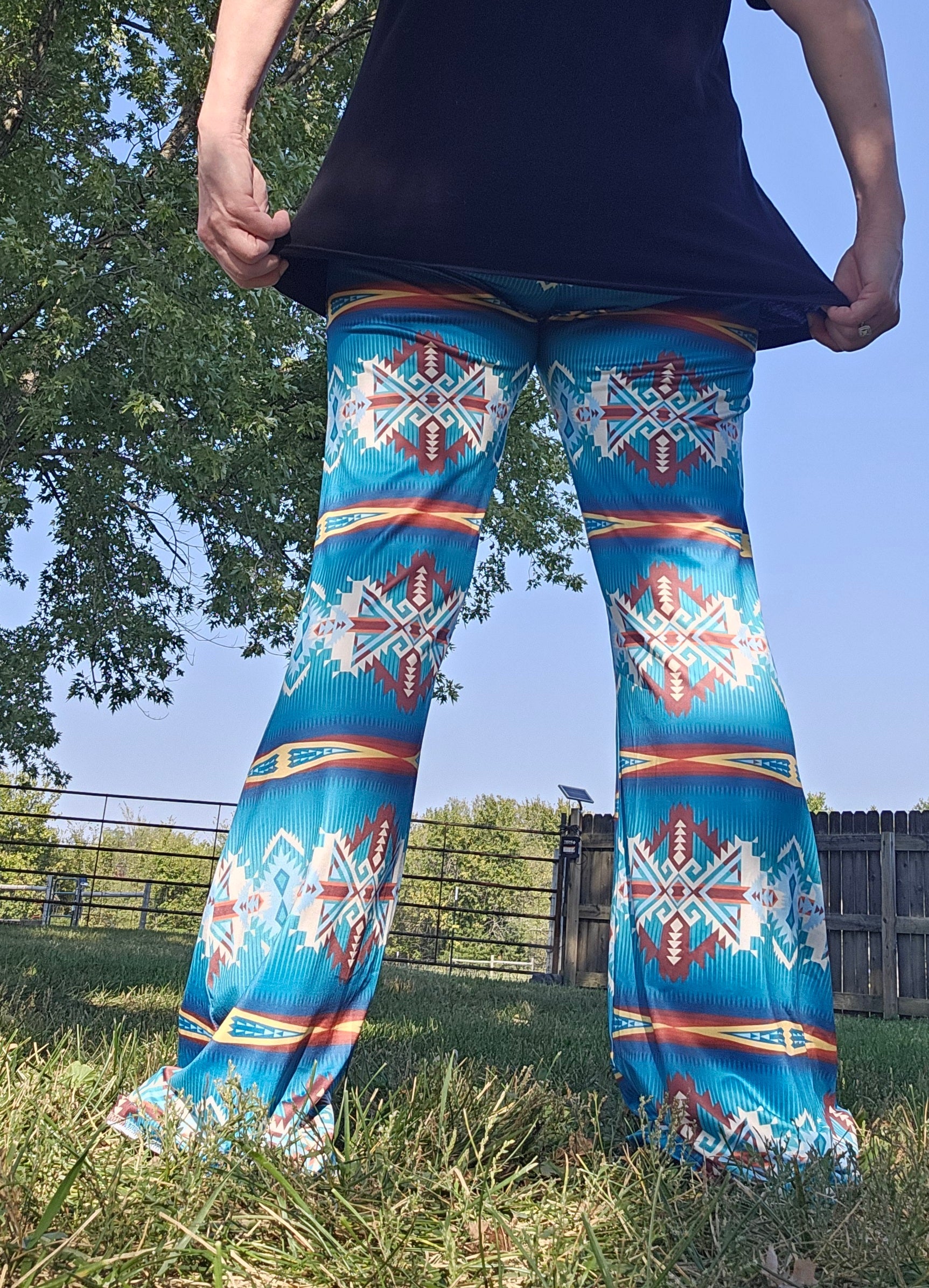 Teal Aztec flare pants with vibrant southwestern print, showcasing comfort and style for festival occasions.