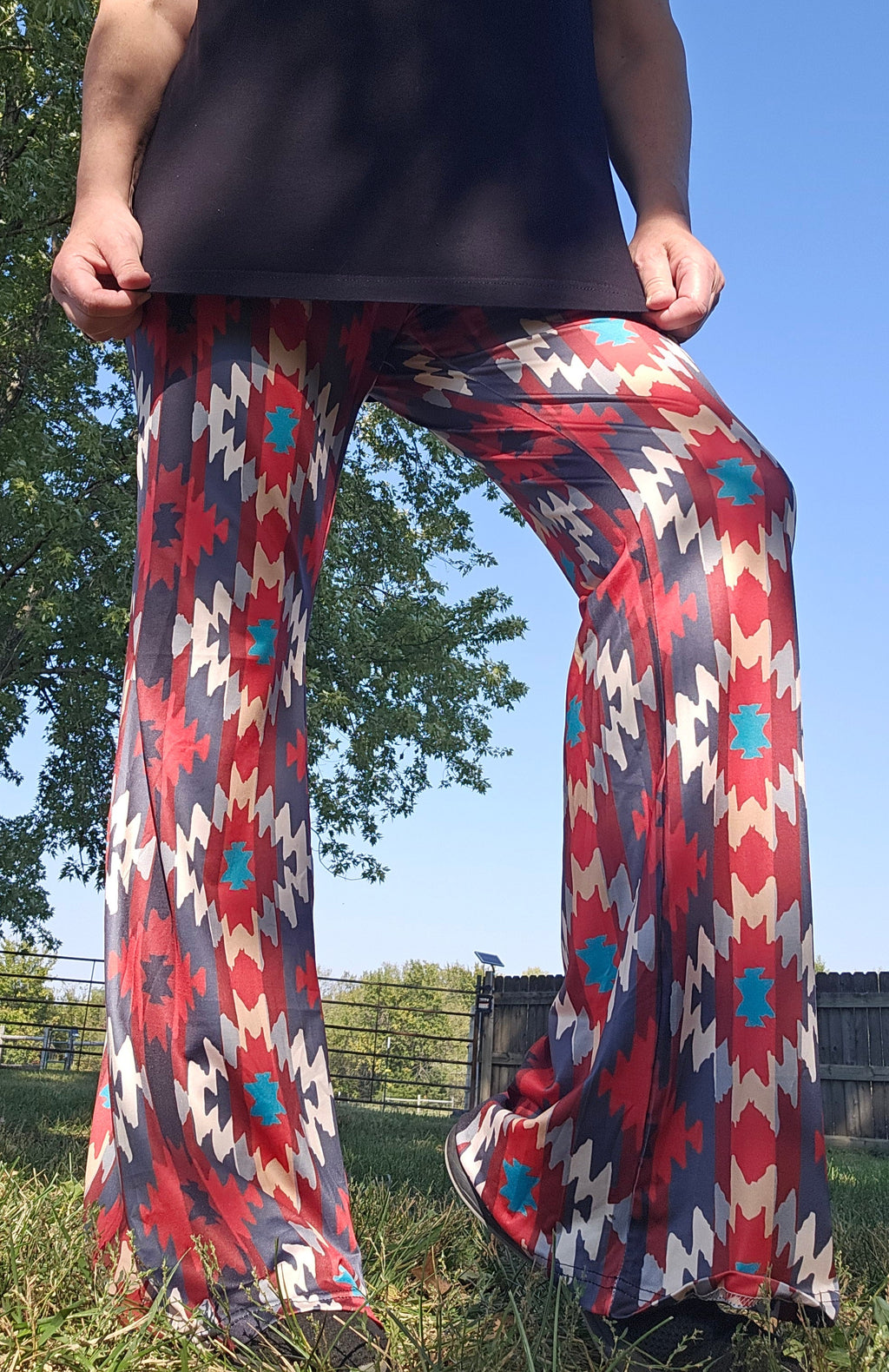 Sedona Aztec Flare Pants in vibrant red and blue, showcasing southwestern style and high-waisted design.