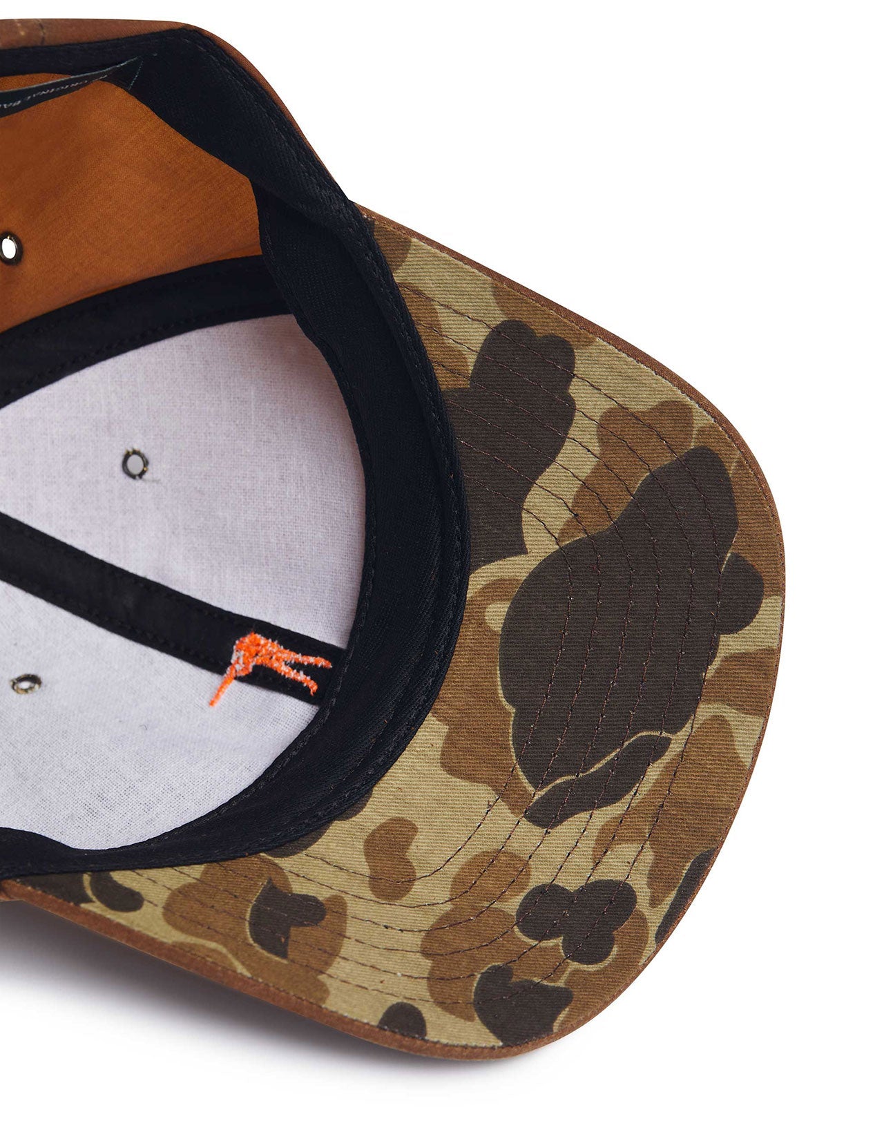 Inside view of the Arthur Field Hat in waxed cotton with a camo pattern, showcasing quality and craftsmanship.