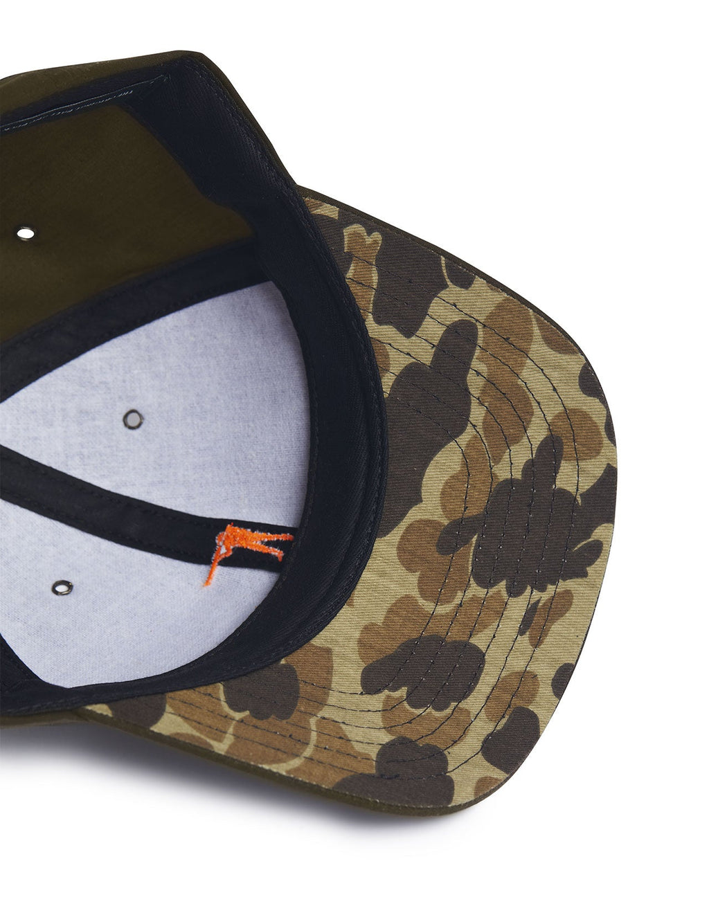 Top view of a camouflage-patterned cap showcasing its waxed cotton material and interior design.