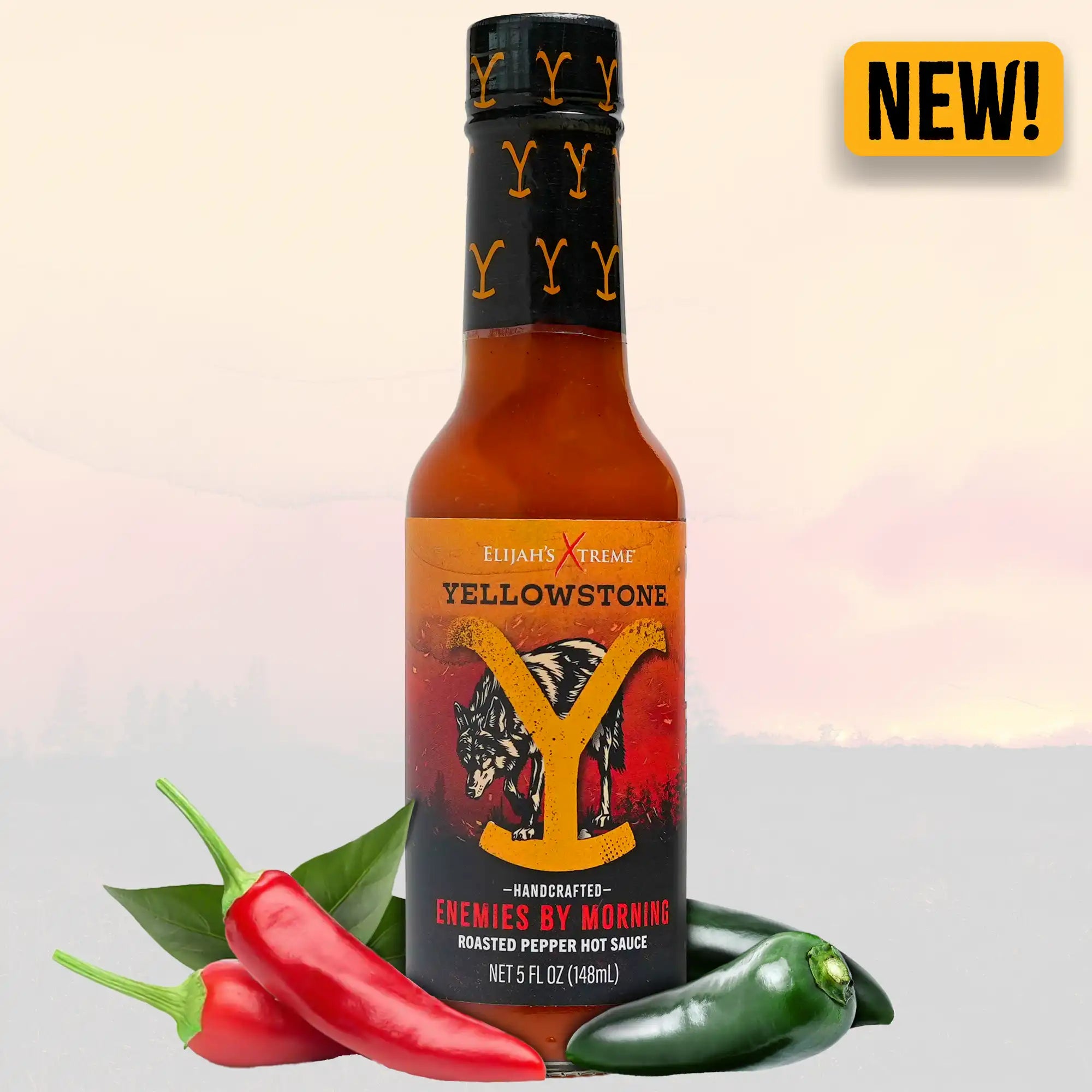 Yellowstone Enemies By Morning Roasted Pepper Hot Sauce bottle with jalapeño and red peppers, highlighting new flavor.
