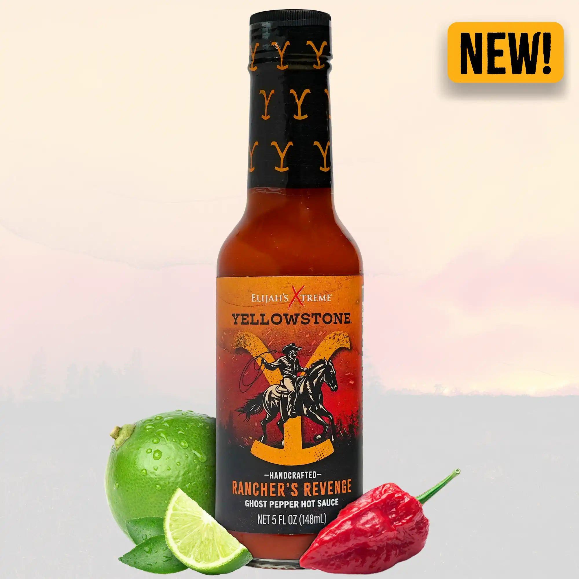 Yellowstone Rancher's Revenge Ghost Pepper Hot Sauce bottle with lime and ghost pepper, featuring a bold new design.