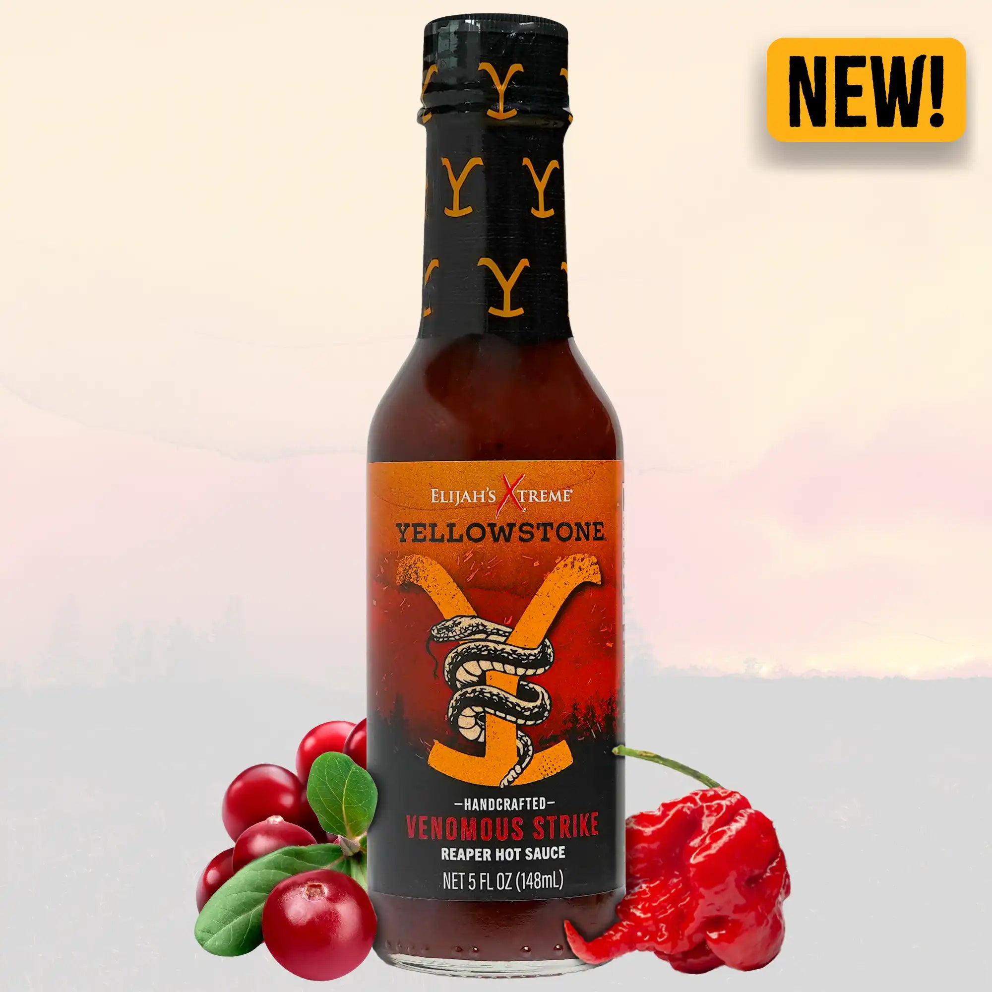 Bottle of Yellowstone Venomous Strike Reaper Hot Sauce with cherries and peppers, new bold flavor for heat lovers.