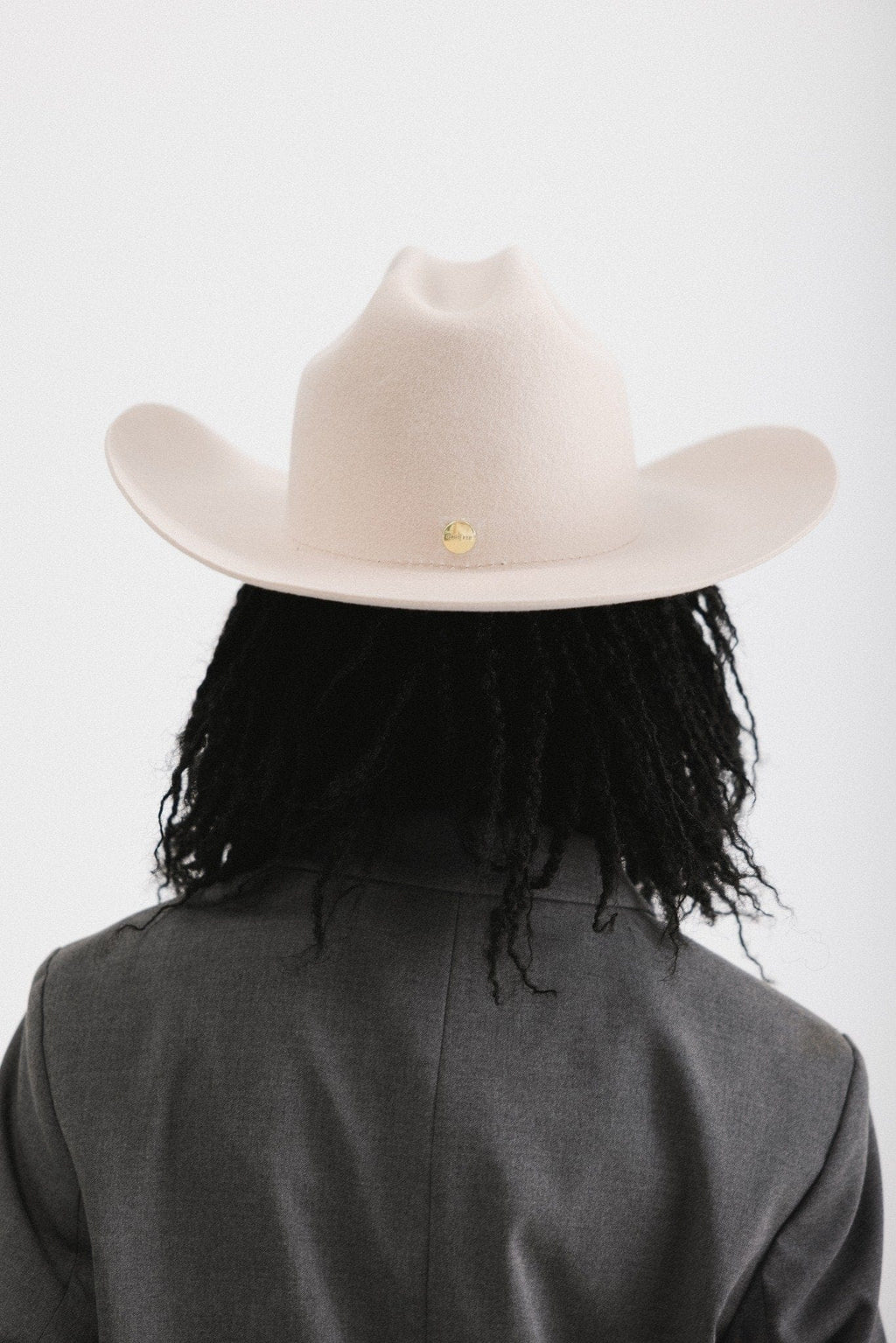 Back view of a woman in a felt Teddy Cattleman cowboy hat, showcasing classic western style.