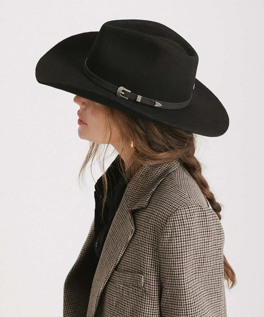 Profile view of a woman wearing the Dean Rancher Cowboy Hat with a stylish blazer, showcasing Western charm.