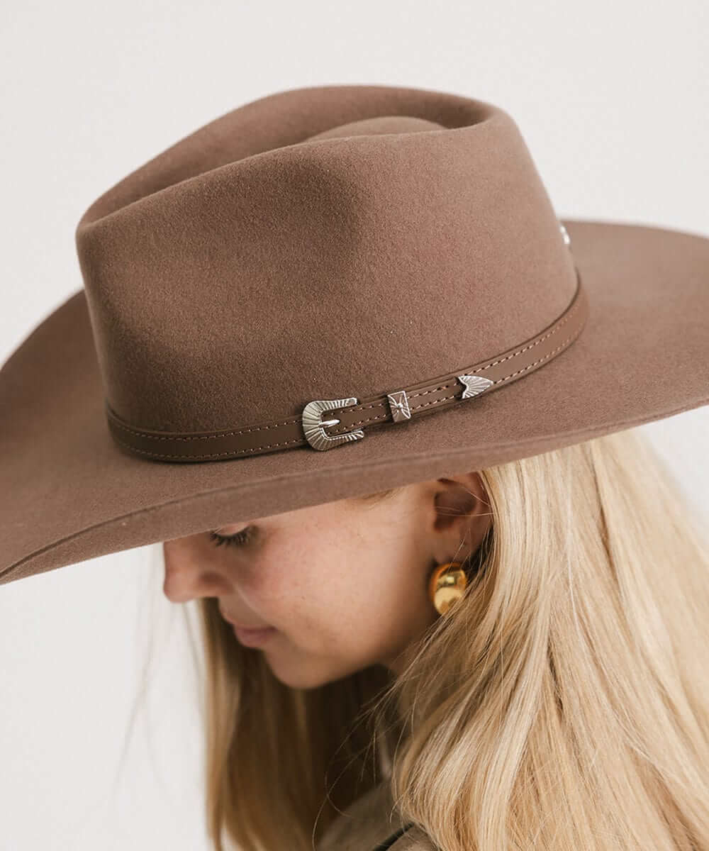 Dean Rancher Cowboy Hat featuring a sculpted crown and leather band with silver buckle detail, perfect for Western style.