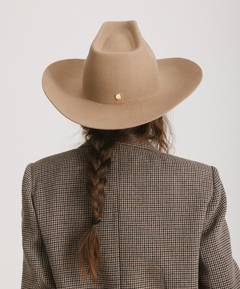 Woman wearing Lane Cowboy Hat with a wide brim and unique brick top crown, showcasing a stylish back view.