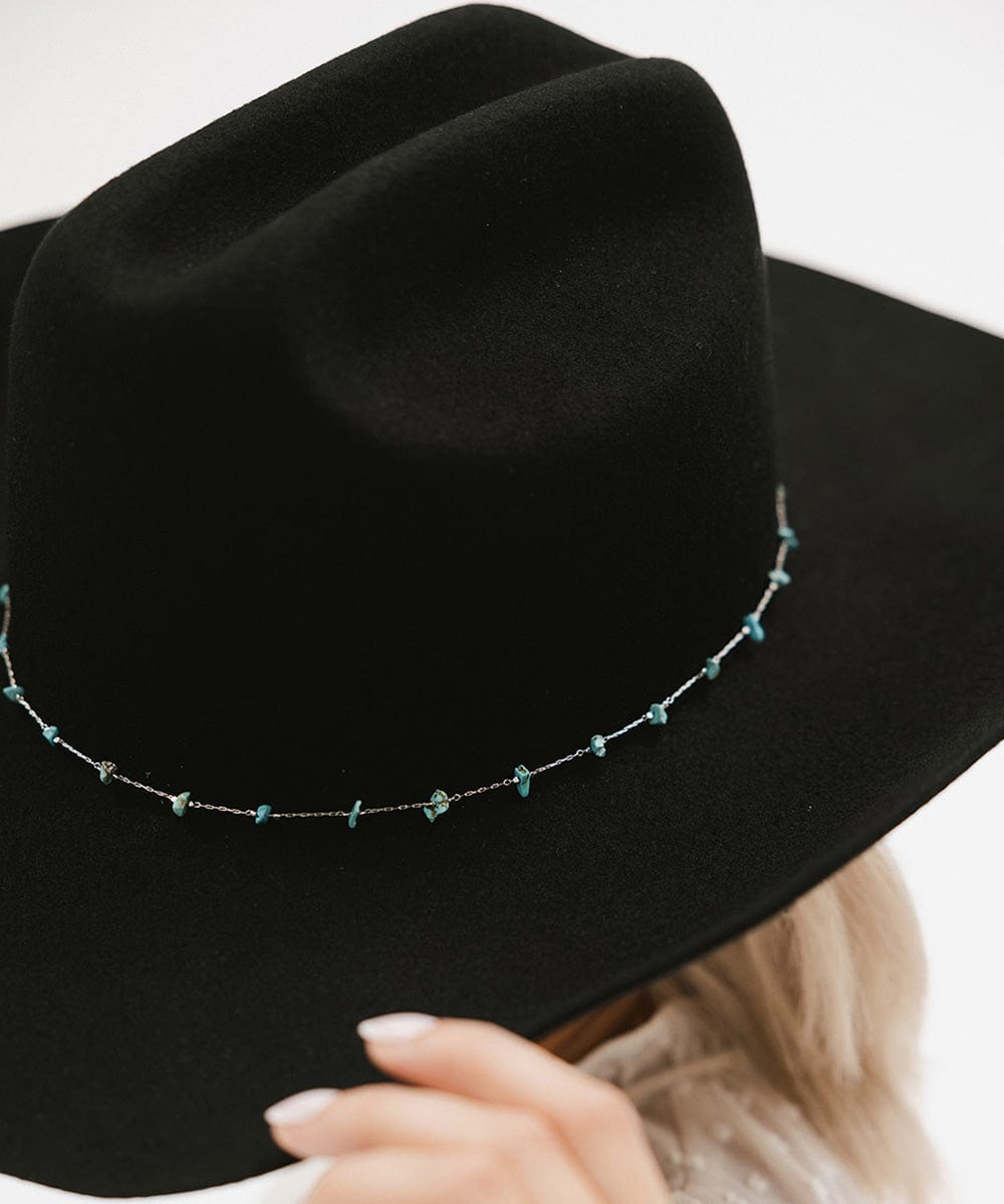Stylish black Teddy Cattleman cowboy hat with turquoise beaded band, perfect for any occasion.