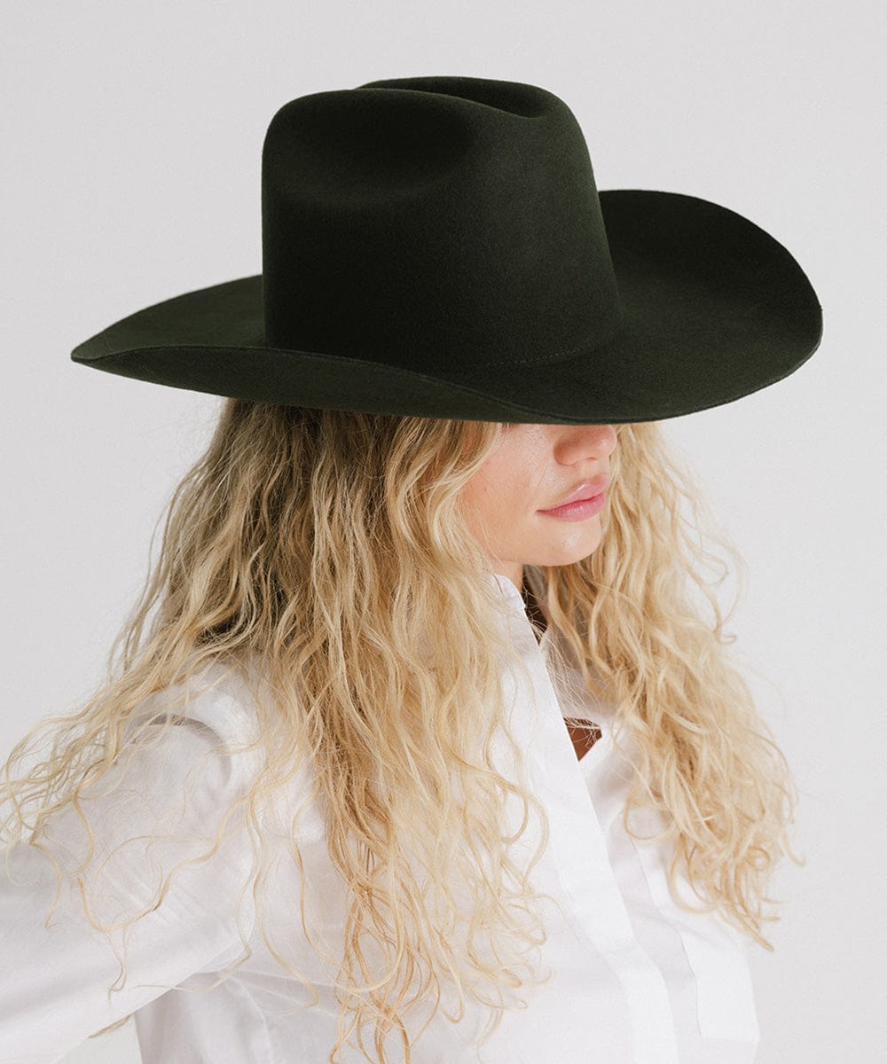 Teddy Cattleman Cowboy Hat on model with curly hair, showcasing western style and timeless design.