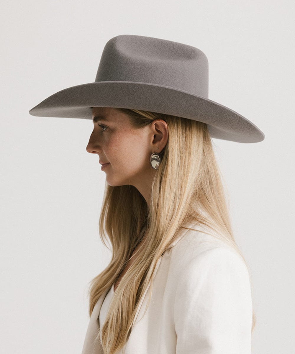Stylish woman in a gray felt Teddy Cattleman cowboy hat, showcasing timeless western fashion.