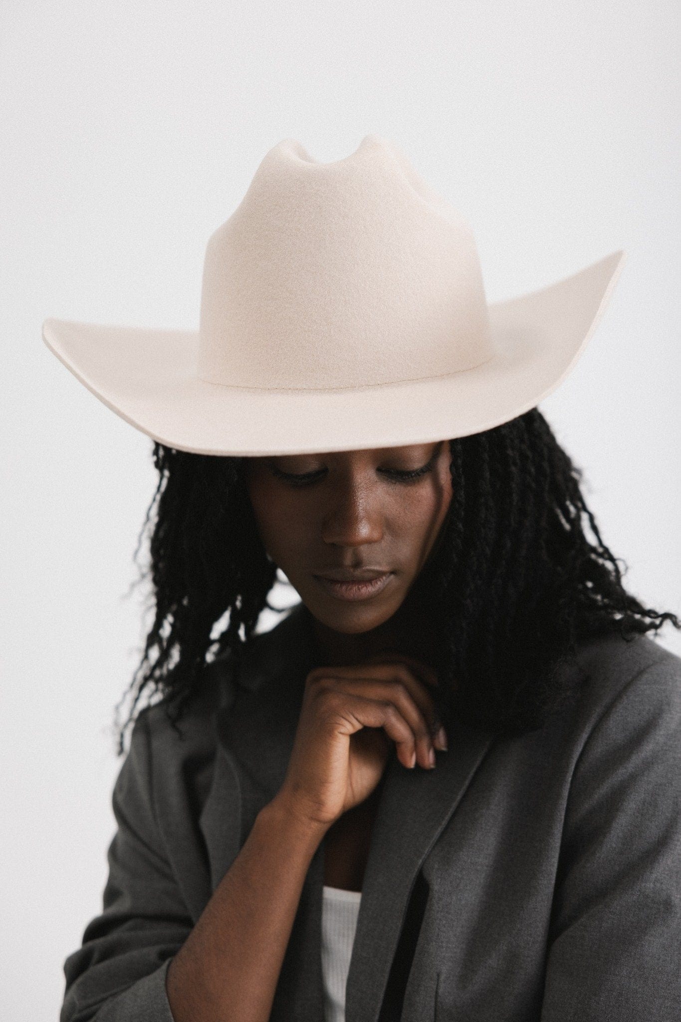 Stylish woman wearing a Teddy Cattleman cowboy hat, showcasing classic western elegance and timeless fashion.