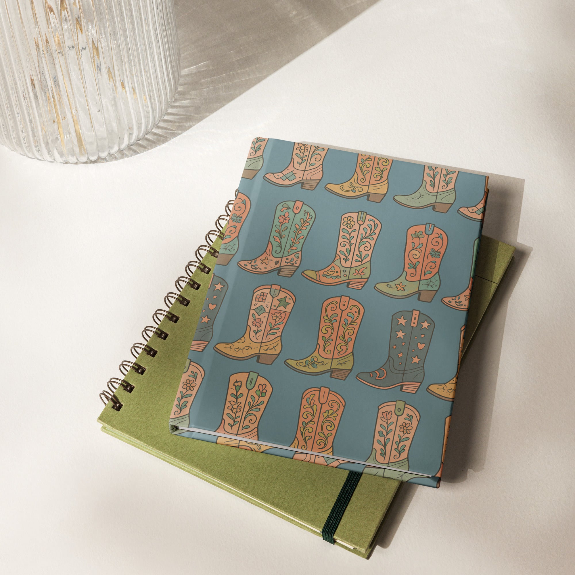 Boot Scootin' hardcover journal with colorful Western boot pattern on a blue background, perfect for creative writing.