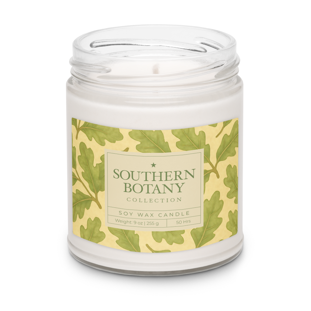 Live Oak candle from Southern Botany Collection in a glass vessel with an elegant leaf design.