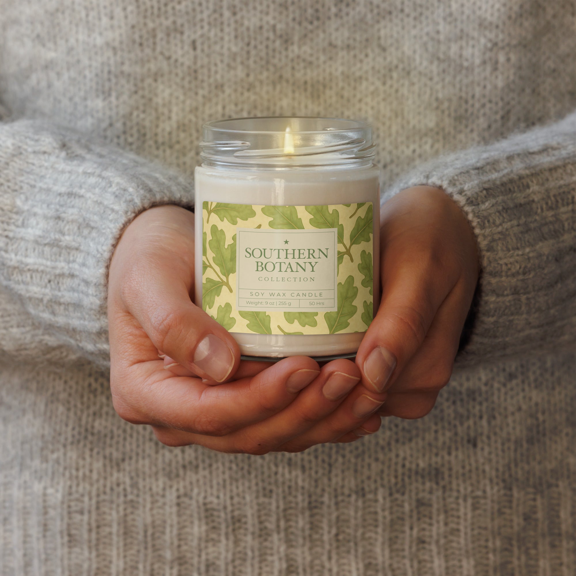 Southern Botany Collection Live Oak candle in a person's hands, showcasing its elegant design and natural charm.