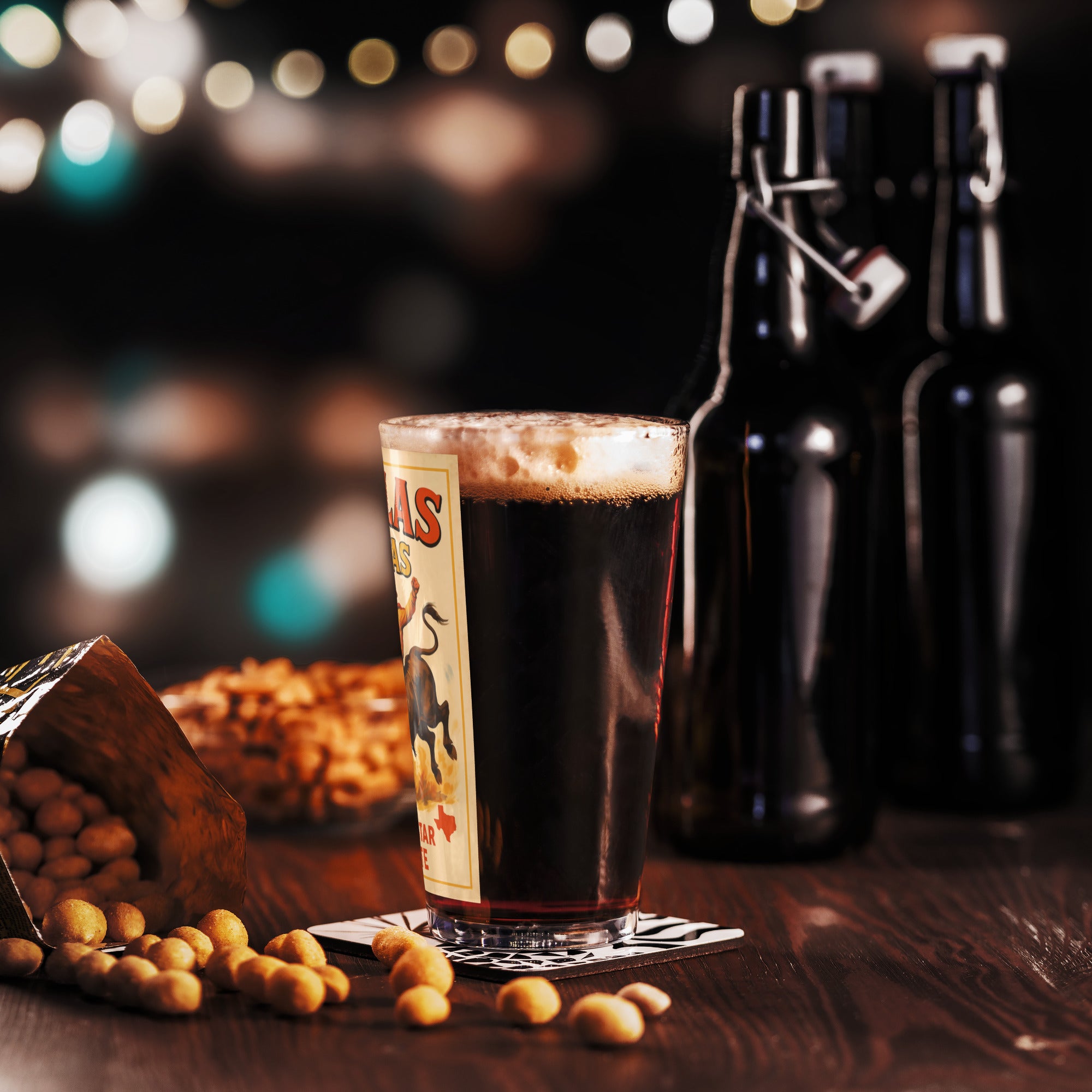 Vintage Dallas Texas pint glass filled with dark beer, surrounded by snacks and beer bottles, evoking a Western ambiance.