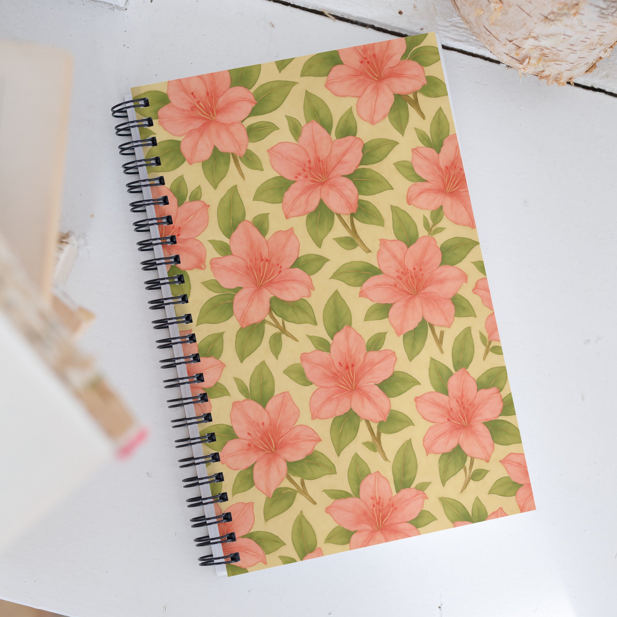 Azalea Spiral Notebook with vibrant floral design on a yellow background, perfect for jotting notes or bullet journaling.