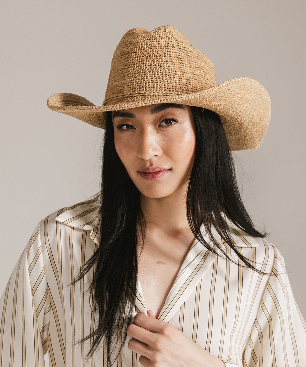Ames Packable Straw Cowboy Hat on a model, showcasing lightweight comfort and timeless Western style.